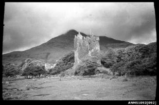 The ruins of Moy Castle, Scotland with Lochbuie House nearby