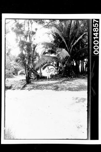 A man stands near a sandy river bed, Cocos Islands