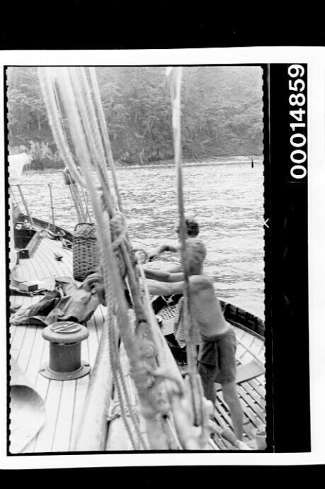 Working on yacht SIRIUS from a wooden dinghy, Cocos Islands