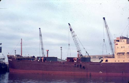 Slide depicting IRON SPENCER cargo vessel alongside the wharf