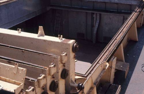 Slide depicting empty cargo hold of a vessel