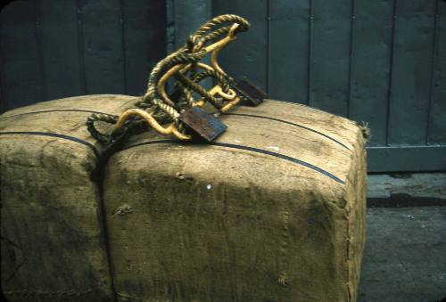 Slide depicting two bails of hessian being moved with a forklift