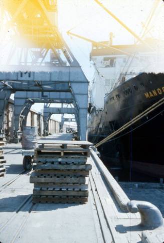 Slide depicting vessel moored alongside a wharf