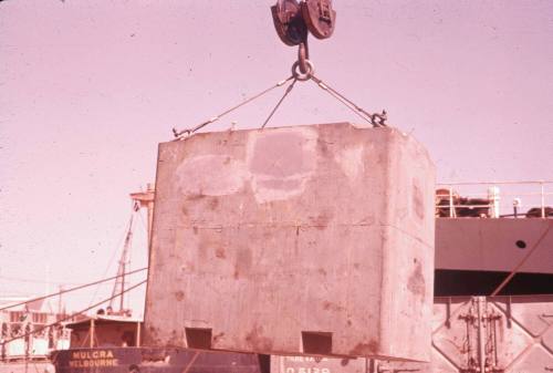 Slide depicting a concrete load being hoisted by a crane