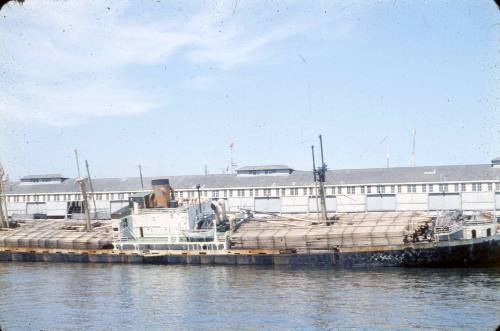 Slide depicting a fully loaded cargo ship listing to the starboard side