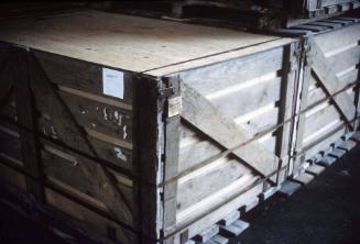 Slide depicting wooden crates on wooden pallets