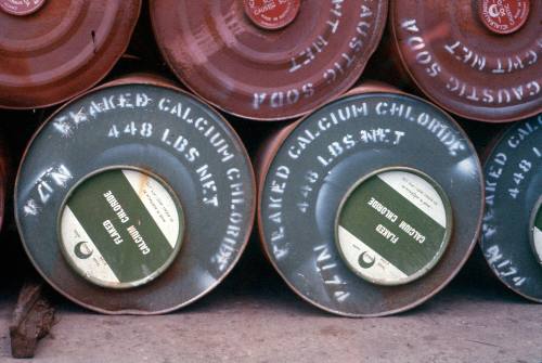 Slide depicting barrels of FLAKED Calcium Chloride