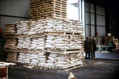 Slide depicting stacks of apple crates