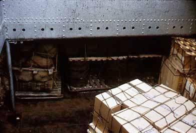 Slide depicting cargo stored in the hull of a ship