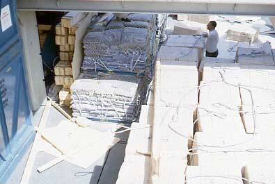 Slide depicting loose materials in loading area on ship