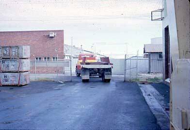 Slide depicting a flat bed truck reversing into a loading area