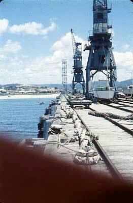 Slide depicting a quay with rail lines running its length