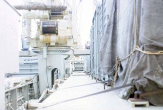 Slide depicting walkway alongside containers on ship