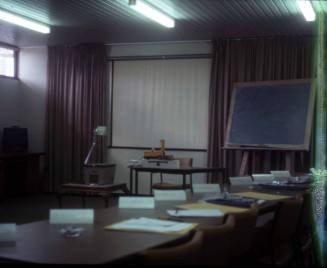 Slide depicting a conference room