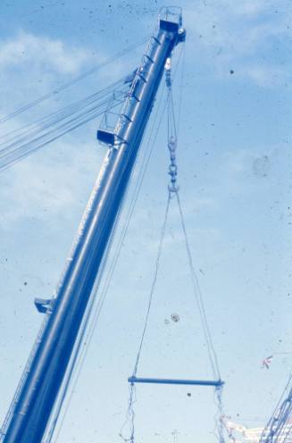 Slide depicting the head of a crane and its cables