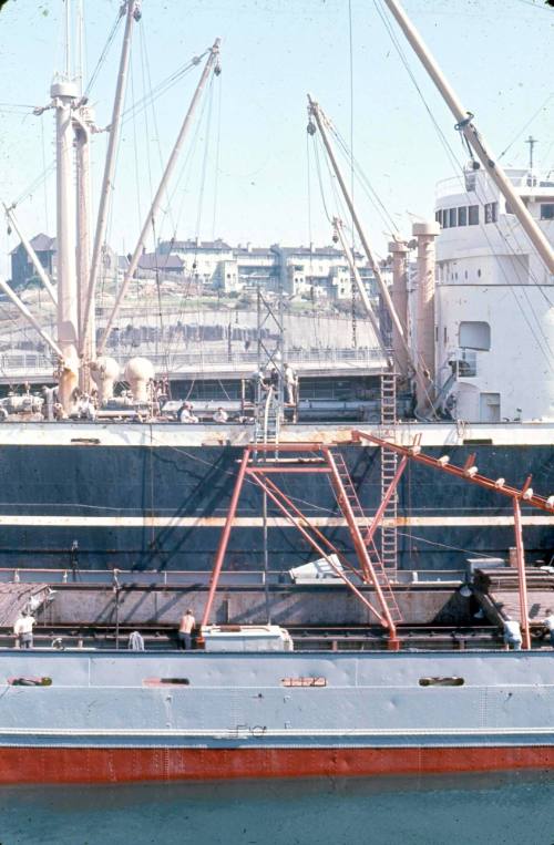 Slide depicting a coaster and an overseas ship alongside eachother