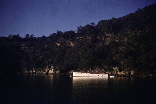 Image of a white hulled boat at mooring in Refuge Bay