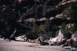 Image of people sitting on rocks at Refuge Bay
