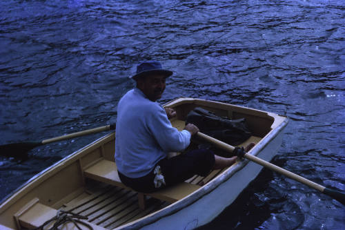 Image of George Clark in a dinghy