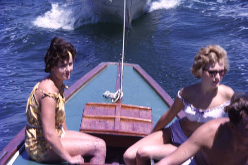 Two women sitting on the stern of a boat