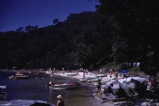 Image of boats anchored off a beach