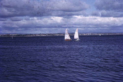 Two sail boats under sail, two cherubs, Perth