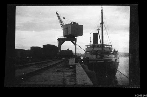 Negative of cargo being loaded onto a steamer