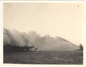 Photograph depicting a tropical island volcano erupting