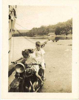 Photograph depicting Margaret and Raleigh Helm on a motorbike