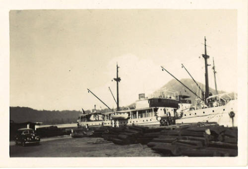 Photograph depicting three docked vessels