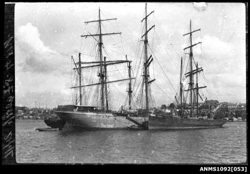 Two-masted schooner SYDNEY moored alongside a three-masted fully rigged ship, Sydney Harbour