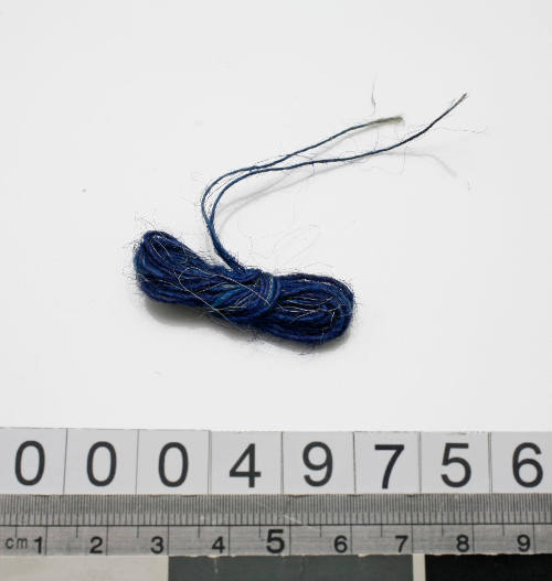 Strand of blue thread from sewing kit used by John Berchmans Kiley on HMAS TINGIRA