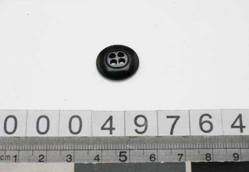 Black plastic button