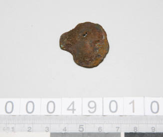 Metal disc with hole claimed to be from the DUNBAR