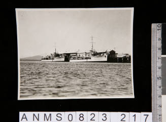Silver gelatin photograph depicting vessels docked at port