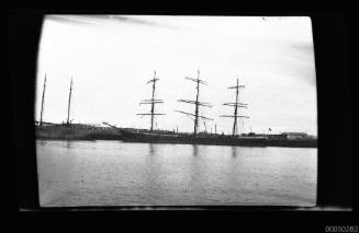 Broadside port view of a three-masted sailing ship