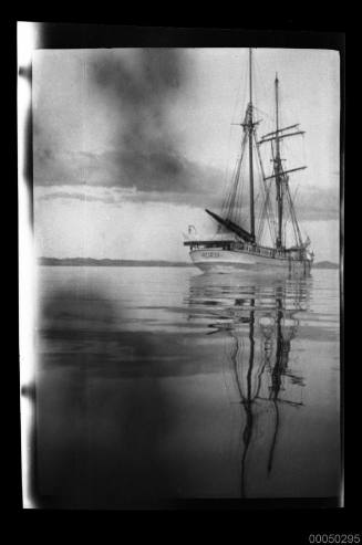 Two-masted ship with furled sails