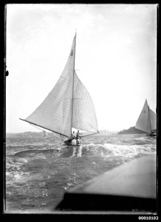 Yacht, possibly HOANA, on Sydney Harbour, with five crew members visible