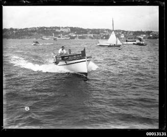 Speedboat displaying the number '38' underway on Sydney Harbour