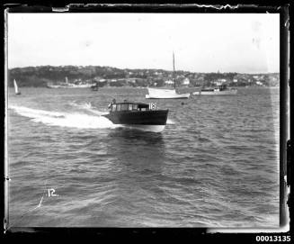 Speedboat displaying the number '18' underway on Sydney Harbour