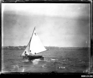 Yacht on Sydney Harbour with the text 'D I' displayed on the mainsail