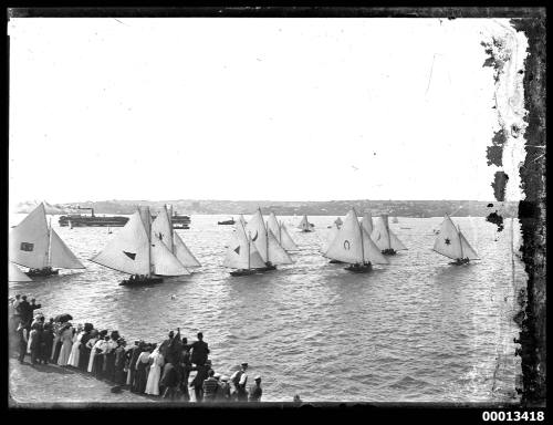 Spectators watching the start of an 18-foot skiff race