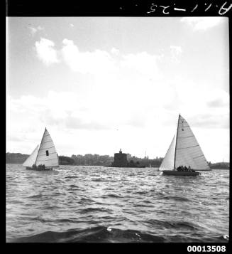 18-foot skiffs CULEX III and TARUA  sailing near Fort Denison, Sydney Harbour, during the 1951 World's 18-foot skiffs Championship
