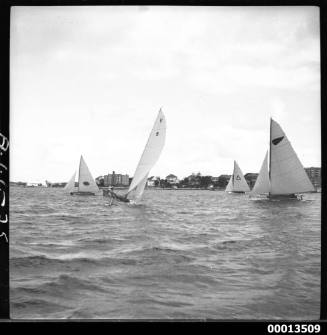 Yachts MYRA TOO (NSW), TARUA  (NZ), BEVERLEY TOO (NZ) and HARMONY (NZ) competing in the 1951 World's 18-foot skiffs Championship on Sydney Harbour