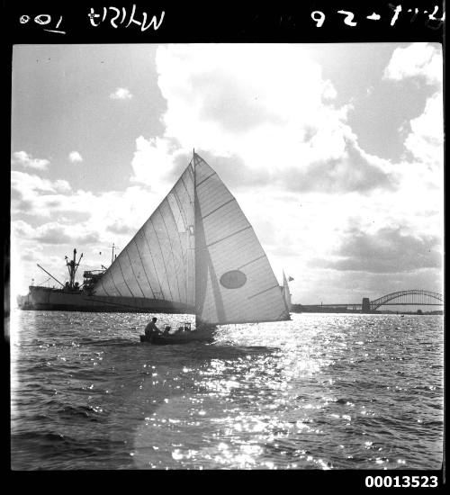 Champion 18-foot skiff MYRA TOO sailing near Garden Island, Sydney Harbour