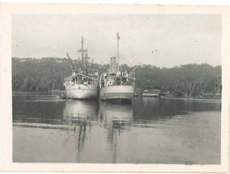 Photograph depicting two vessels anchored alongside each other