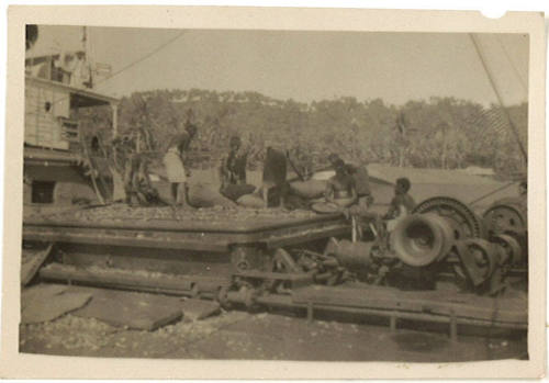 Photograph depicting a group of men on the deck of a vessel