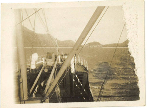 Photograph depicting a view of islands from the bow of a vessel