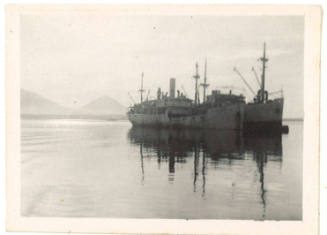 Photograph depicting two vessels anchored alongside each other