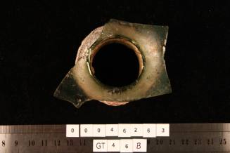 Bottle cap attached to glass from the wreck of the VERGULDE DRAECK